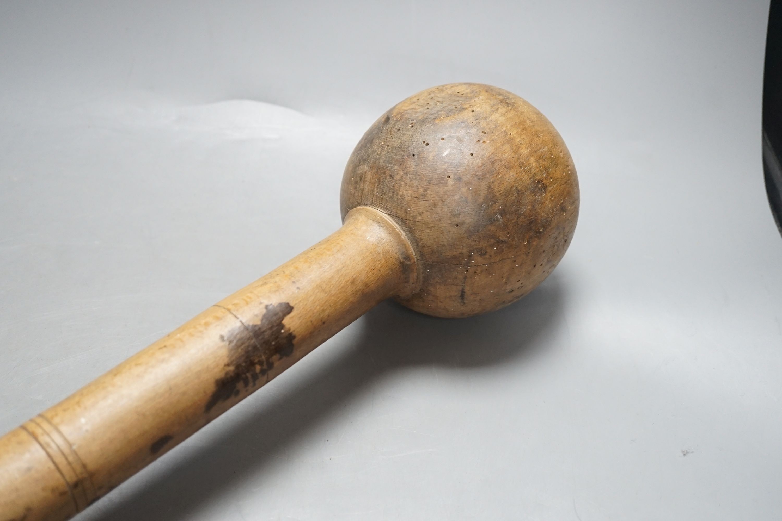A turned beech wine grape masher - 61cm